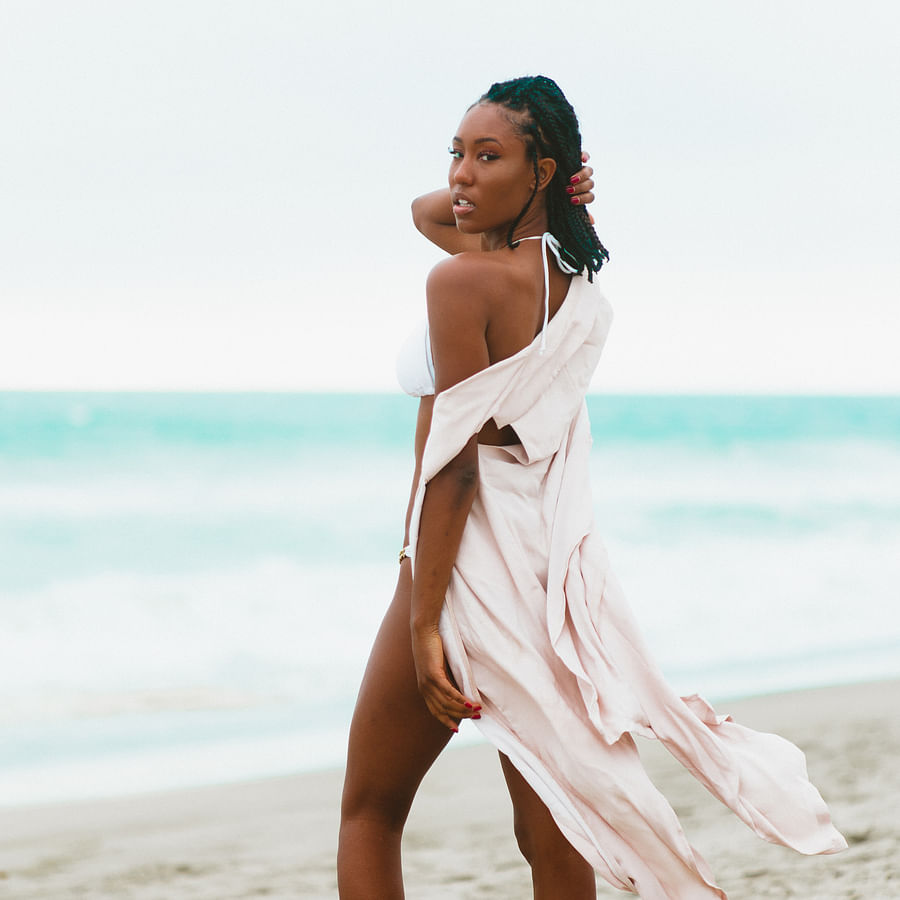 Close-up view of a person watering a succulent plant